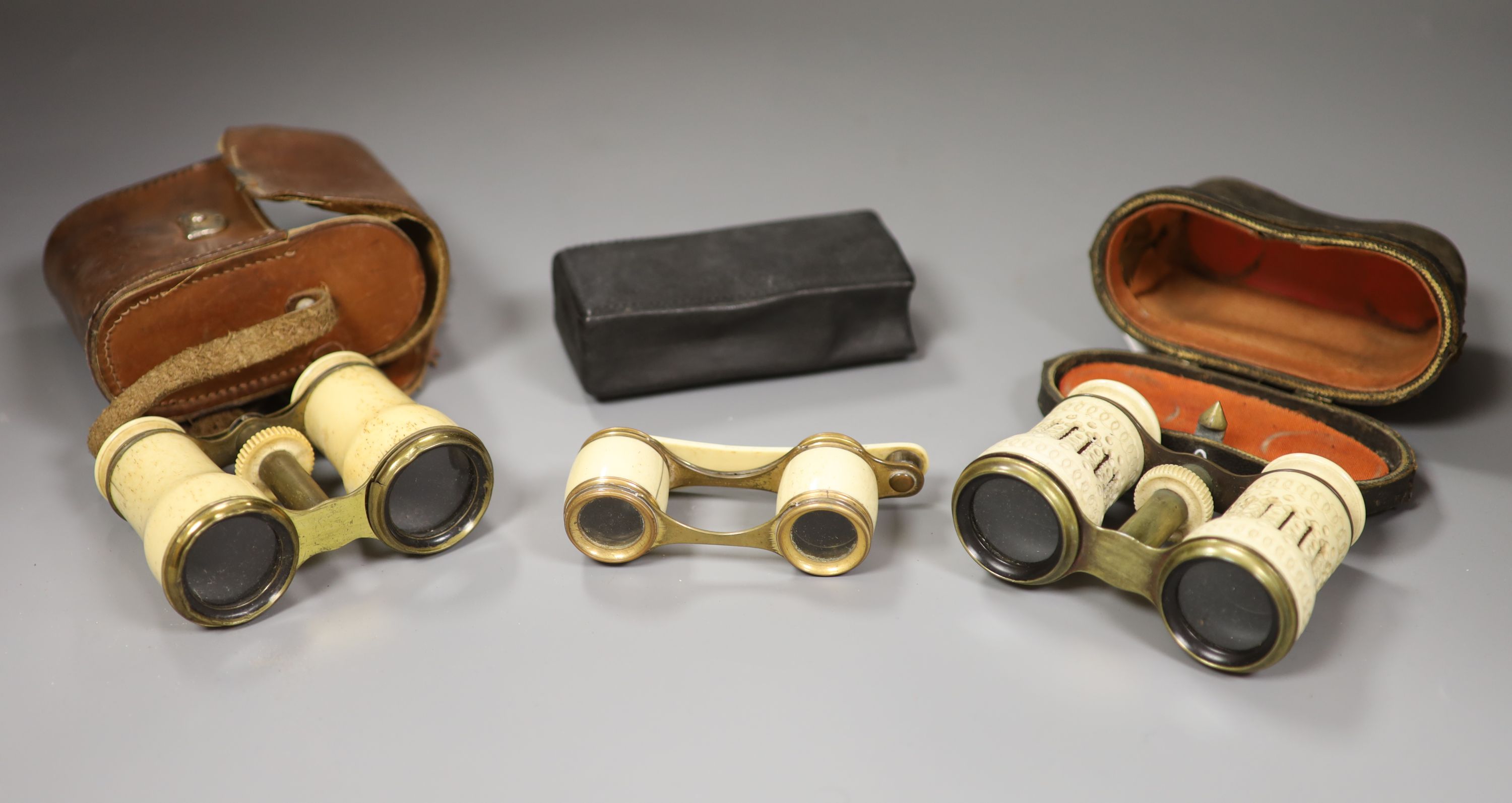 Three pairs bone opera glasses